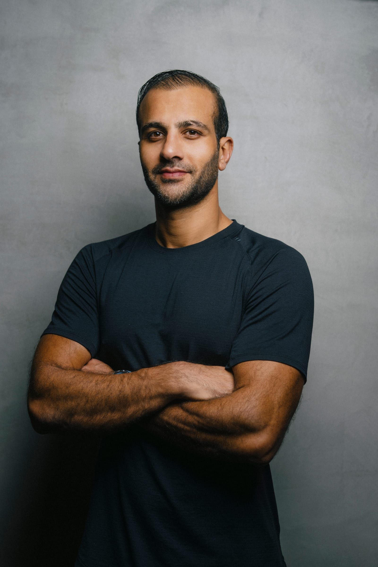 Portrait of Mohamed Sultan with his arms crossed
